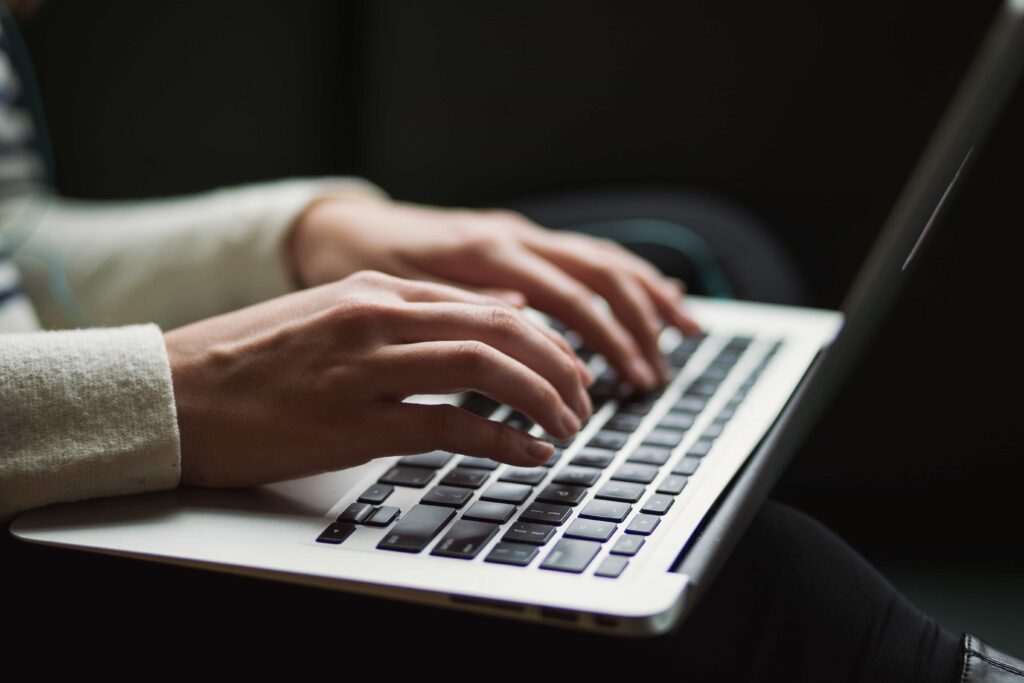 man typing on a computer